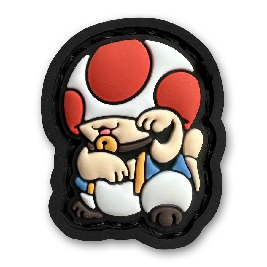 Toad Neko RE PVC ranger eye patch of a character with a mushroom head and white clothes sitting in a lucky cat maneki-neko pose.