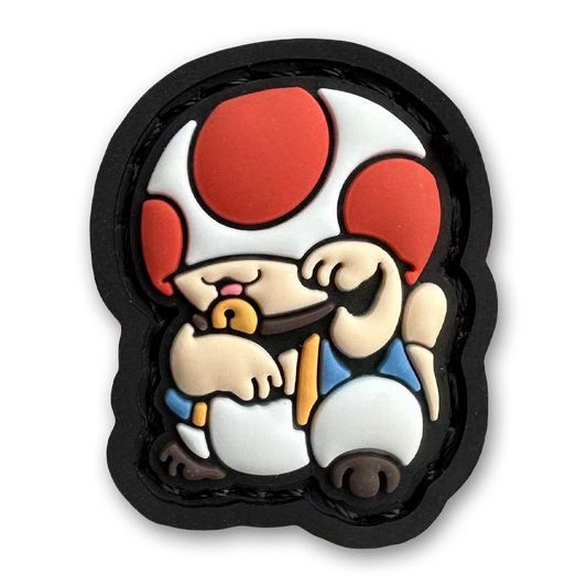 Toad Neko RE PVC ranger eye patch of a character with a mushroom head and white clothes sitting in a lucky cat maneki-neko pose.