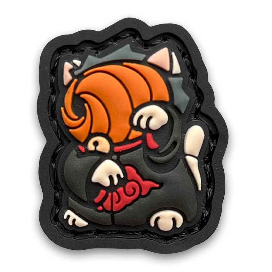 Tobi Neko RE PVC ranger eye morale patch of a character in an orange mask and robe with red clouds sitting in a lucky cat maneki-neko pose.